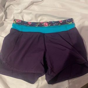 Girls purple and teal floral Ivivva Speedy shorts
